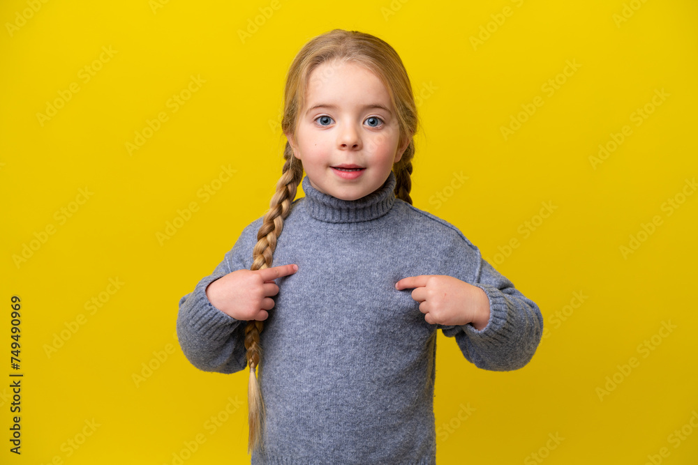 Wall mural Little caucasian girl isolated on yellow background with surprise facial expression