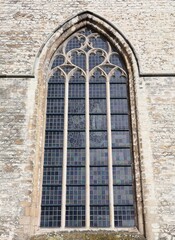 Stained glass window in Gothic style. Close up of a beautiful window in a church.