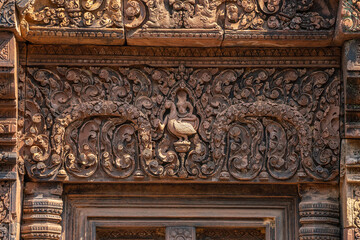 Bas-relief of Banteay Srei, the temple known for its beautiful carvings on red sandstone in Siem Reap, Cambodia. - 749499189