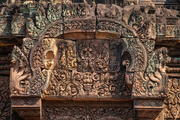 Bas-relief of Banteay Srei, the temple known for its beautiful carvings on red sandstone in Siem Reap, Cambodia. - 749499193