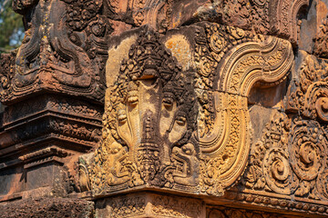 Bas-relief of Banteay Srei, the temple known for its beautiful carvings on red sandstone in Siem Reap, Cambodia. - 749499321