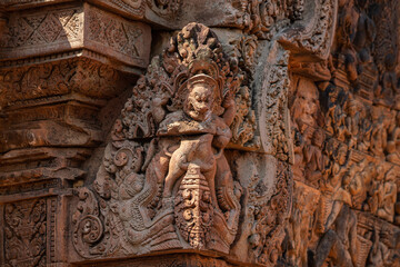 Bas-relief of Banteay Srei, the temple known for its beautiful carvings on red sandstone in Siem Reap, Cambodia. - 749499392