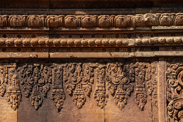 Bas-relief of Banteay Srei, the temple known for its beautiful carvings on red sandstone in Siem Reap, Cambodia. - 749499541