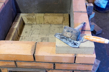 construction of brick ovens. brick stove for sauna. heating stone stove.