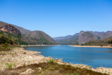 Fototapeta na wymiar Reservoir and mountain landscape in Mae Ping National Park. Thailand.