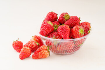 Fresh strawberries on monochrome background