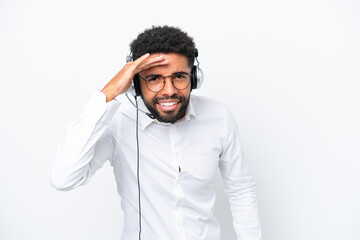 Telemarketer Brazilian man working with a headset isolated on white background looking far away with hand to look something - obrazy, fototapety, plakaty