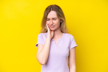 Blonde English young girl isolated on yellow background with toothache