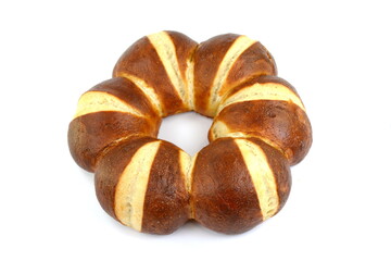 Freshly baked traditional German laugenbrot. Bavarian homemade pretzel rolls lye bread, close-up, isolated on white background.