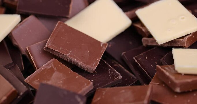 mixed together different types of chocolate, white, bitter and milk chocolate pieces