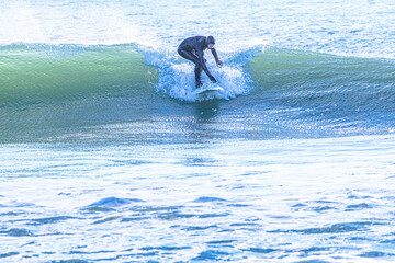 Surfer enjoying the waves at Bournemouth Beach.