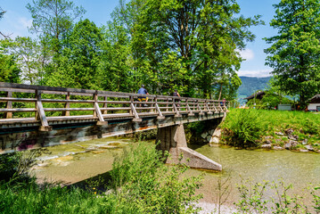 Fototapeta na wymiar A bridge over a mountain river in the Bavarian Alps