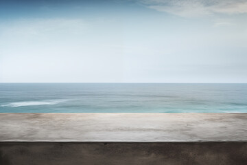 The empty concrete table top with a blurred background of ocean