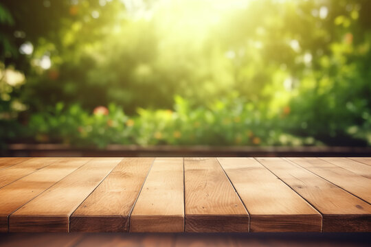 The empty wooden table top with a blurred background of a summer backyard