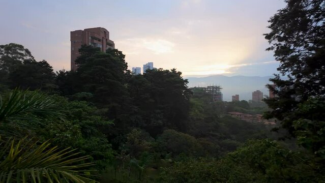 Sunset in Medellin with Apartment Highrises underconstruction, rising out of the lush jungle