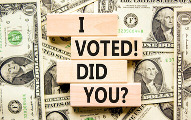 I voted. Did you symbol. Concept words I voted. Did you on beautiful wooden block. Beautiful dollar bills background. Dollar bills. Business I voted. Did you concept. Copy space.