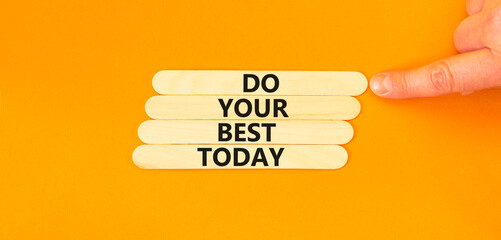 Do your best today symbol. Concept words Do your best today on wooden stick. Beautiful orange table orange background. Businessman hand. Business motivational do your best today concept. Copy space.