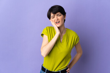 Woman with short hair isolated on purple background with toothache