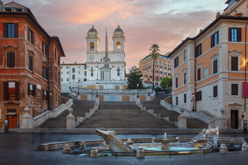 Fototapeta na wymiar Fountain of Boat and Spanish steps with Trinita dei Monti church in Rome