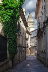 Fototapeta na wymiar Pedestrian street and historic building facades in old town Santiago de Compostela, Spain.