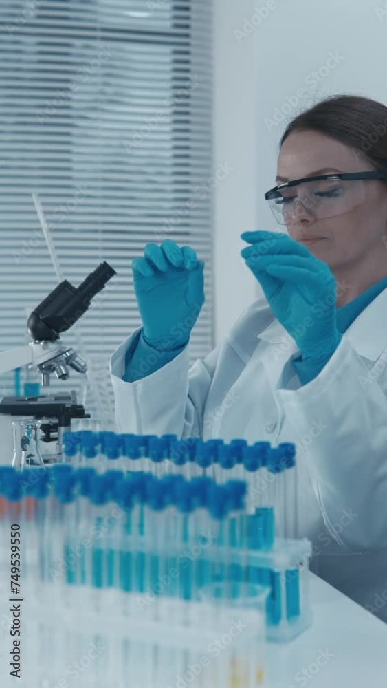 Poster In the laboratory, the pharmacist-analyst controls the quality and purity of medicines. A bioinformatician analyzes genomic data using computer programs to identify genetic differences.