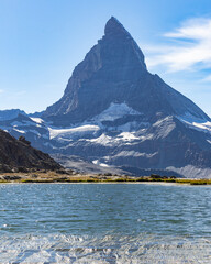 Matterhorn Mountain with white snow and blue sky in summer in Switzerland