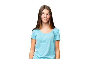 Teenager girl over isolated chroma key background having doubts while looking up