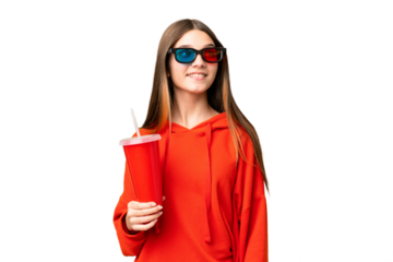 Teenager girl in a cinema over isolated chroma key background thinking an idea while looking up