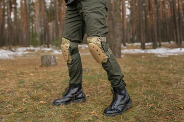 Tactical knee pads protect the legs of soldiers and warriors. Camouflage gear for convenience