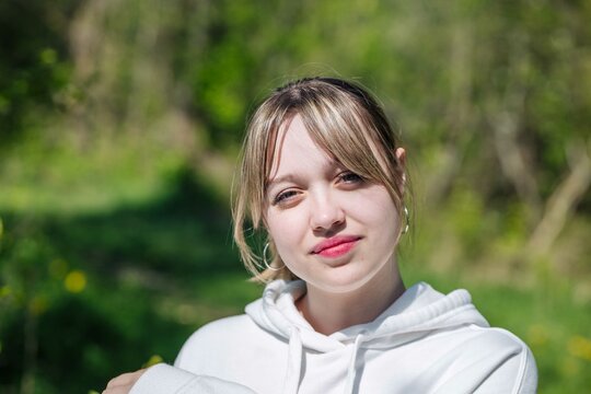 Portrait of a Russian schoolgirl on a sunny day.