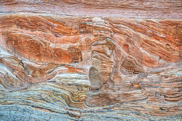 Sandstone is a clastic sedimentary rock composed mainly of sand-sized silicate grains.