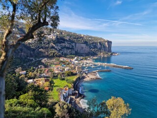 Naklejka na ściany i meble The Magnificent Amalfi Coast in Italy is a breathtaking stretch of coastline renowned for its dramatic cliffs, charming villages, and crystal-clear waters.
