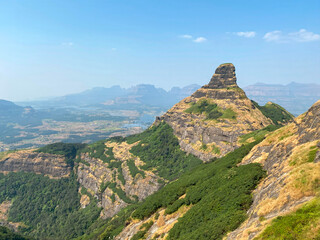 Fototapeta na wymiar View of the mountain ranges while climbing up Ratangad Fort near Bhandardara in Ahmadnagar district of Maharashtra India