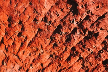 Rotbraune alte Backsteinwand mit Muster als Hintergrund