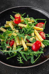 pasta salad tomato, arugula, boiled pasta fresh food tasty healthy eating cooking appetizer meal food snack on the table copy space food