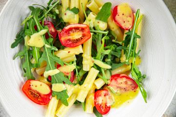 pasta salad tomato, arugula, boiled pasta fresh food tasty healthy eating cooking appetizer meal food snack on the table copy space food