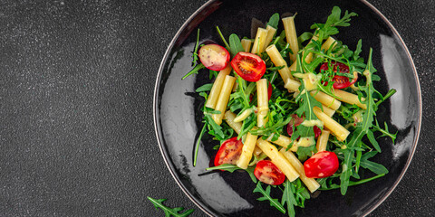 pasta salad tomato, arugula, boiled pasta fresh food tasty healthy eating cooking appetizer meal food snack on the table copy space food