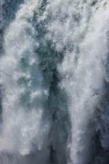 Obraz premium Abstract image of water rushing over Victoria Falls