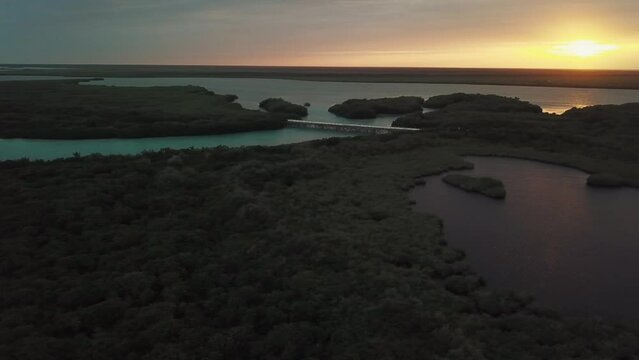 Aerial view of the SIan Kaan reserve right at the only bridge that there is in the way to Punta Allen, at sunset, Sian Kaan Reserve, Quintana Roo, Mexican Caribbean