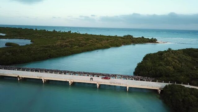 Aerial view of the bridge that croses into the sea from the Sian Kaan lagoons,  in Tulum, Riviera Maya in the Mexican Caribbean 