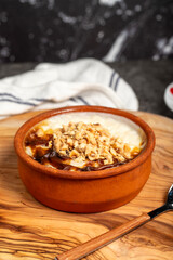 Rice pudding dessert. Milk dessert.Baked rice pudding on a dark background. Local name sütlaç