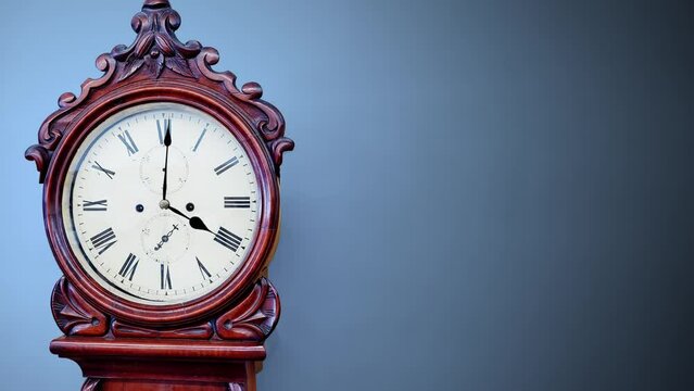 Old cherry wood grandfather clock, timepiece, time, timeless, time passing, antique, pendulum, on a gray background