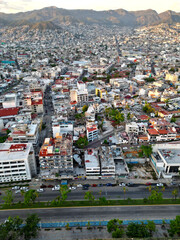 Obraz premium High-angle vertical photograph capturing the vibrant and bustling center of Acapulco, showcasing its dense urban landscape