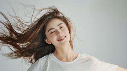 Fototapeta premium Portrait photography of young woman Wears a white t-shirt, has long hair and is cute and beautiful.