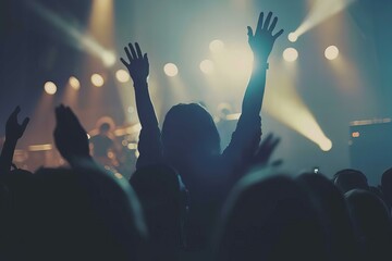 Silhouette of Woman with Hands Up at Concert