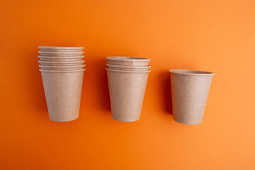 Recycling paper coffee cup with copy space. Craft cup for a hot drink to go. Disposable cup. Eco package. Cardboard coffee cup