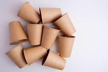 Recycling paper coffee cup with copy space. Craft cup for a hot drink to go. Disposable cup. Eco package. Cardboard coffee cup