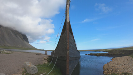 Old abandoned Viking Village boat, former movie set, in Stokksnes, Iceland. - obrazy, fototapety, plakaty