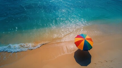 Obraz premium Colorful Umbrella on Sandy Beach