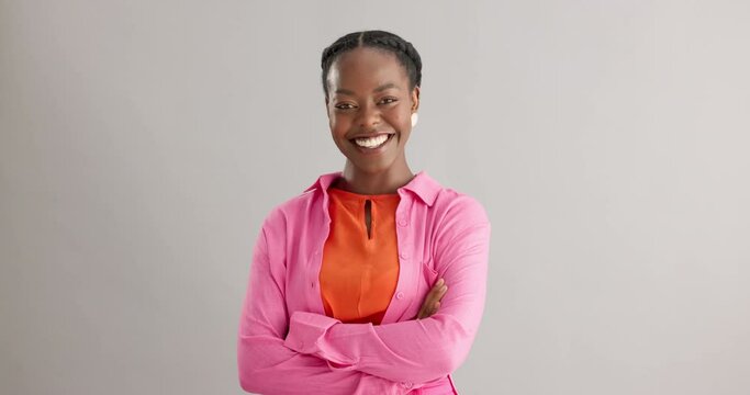 Black woman, arms crossed and portrait with smile in studio for fashion, confidence and pride on grey background. African person, happy and face of person with trendy, style and positive mindset